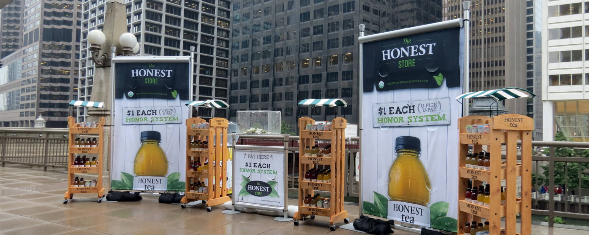 giant tea bottles with banners