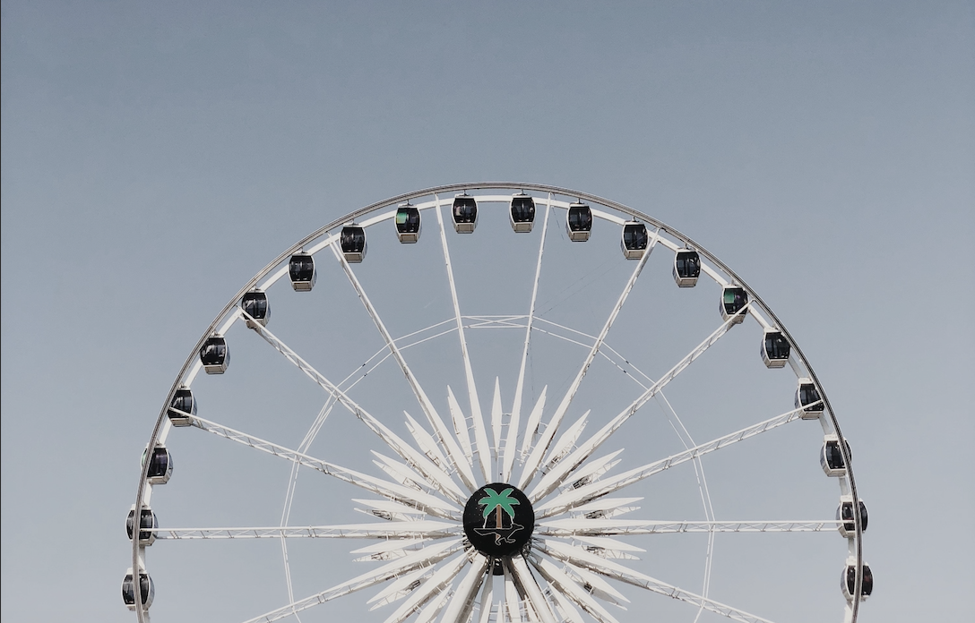 Coachella ferris wheel in front of a blue sky